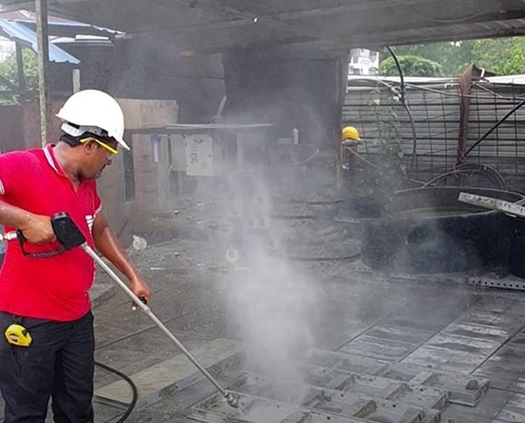 A worker providing the exhaust fan service to clean the fan